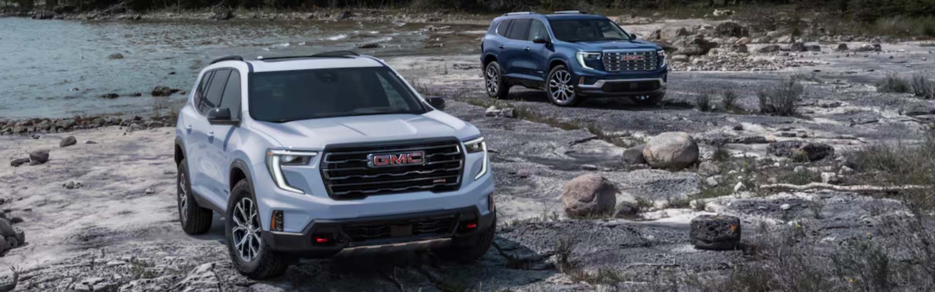 GMC Acadia models with scenic background